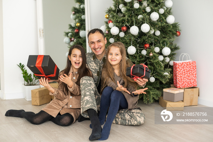 Soldier returning home to join his family for Christmas vacations. military father and family near c