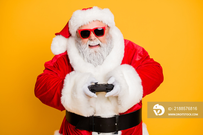 Portrait of funny funky crazy santa claus play videogame on newyear holly noel celebration have exci