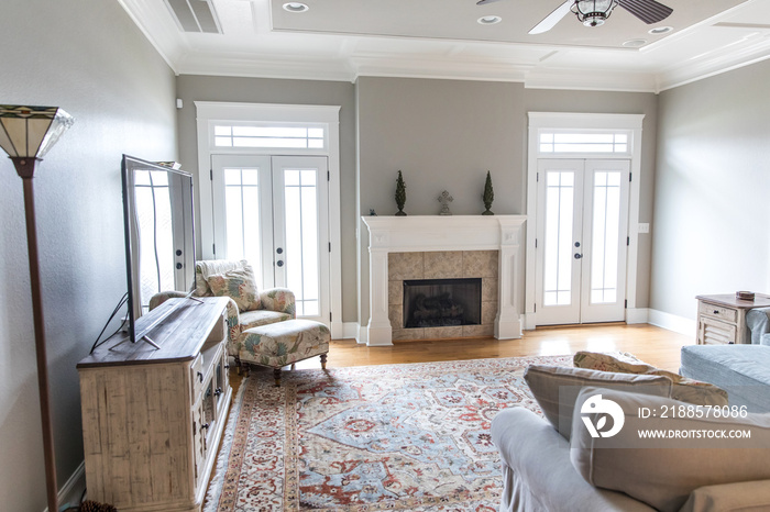 a bright and airy neutral beige living room den in a new construction house with a white and tiled f