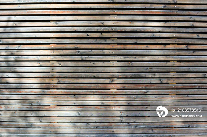 Facade pattern with wooden formwork of an apartment building in the city, residential home with sust