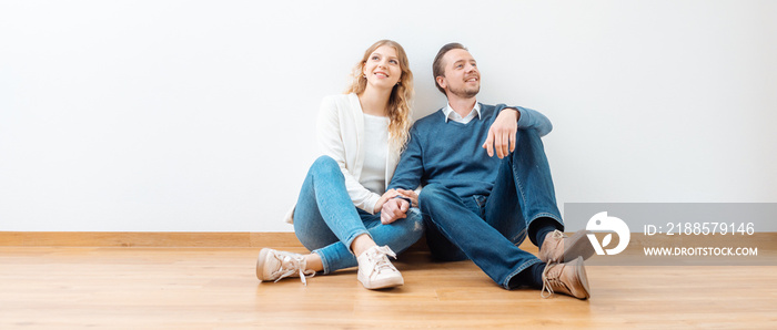 Couple dreaming about their future in the new apartment