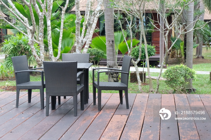 Table and chairs in front of the balcony.