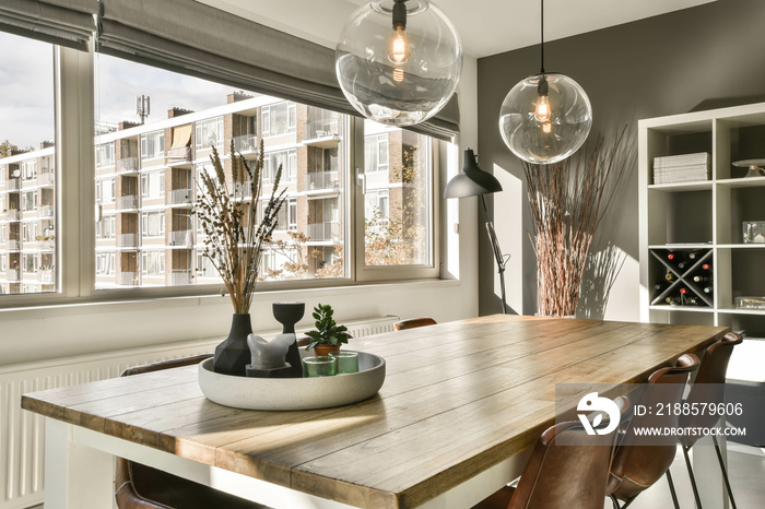 Cozy dining area under a spherical chandelier in a modern house