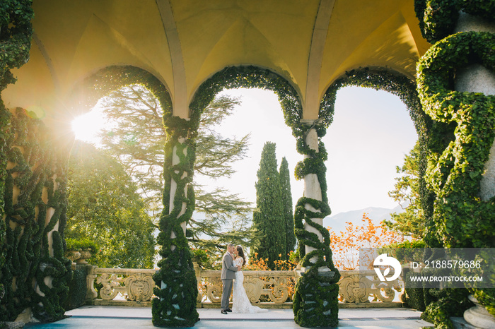 Villa Balbianello wedding photoshoot beautiful couple bride and groom long veil and white dress on m