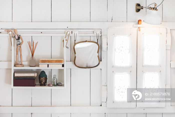 interior of light modern wooden house inside, vintage window with shutters and decorative curtains. 