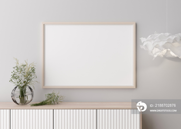 Empty horizontal picture frame on white wall in modern living room. Mock up interior in minimalist, contemporary style. Free space for your picture. Console, flowers in vase, lamp. 3D rendering.