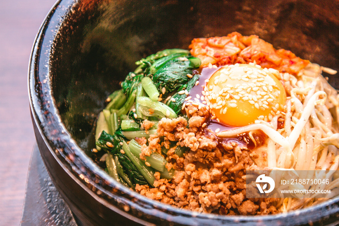 Bibimbap in a heated stone bowl, Korean food