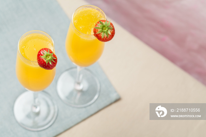 Mimosa cocktail and strawberries