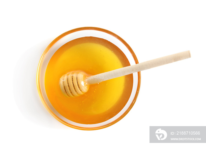 Glass bowl with dipper and delicious honey on white background