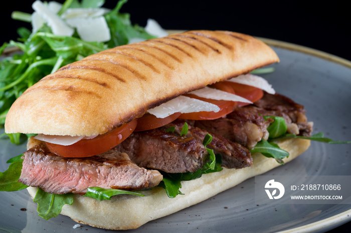 grilled steak medium fresh baked ciabatta sandwich beer