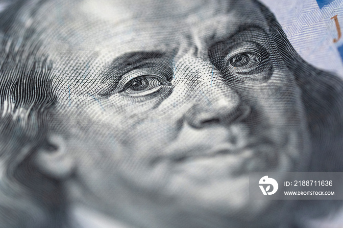 Benjamin Franklin’s face on the US 100 dollar bill. Closeup. Point focus.