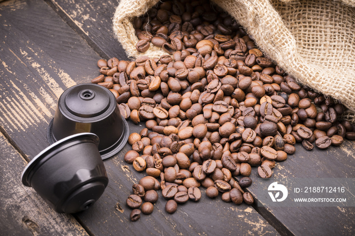 Bag and coffe capsules on old rusty table