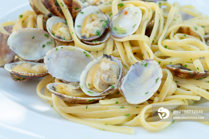 Traditional Italian seafood, spaghetti vongole made with seashells and linguini pasta