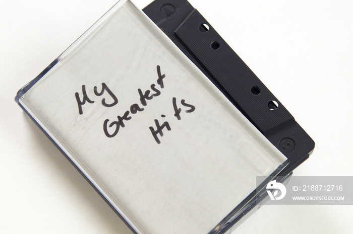 My greatest Hits in handwriting written on music cassette tape case