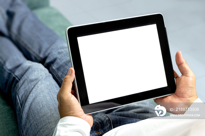 Men sit and relax on the couch and hold the mobile tablets in hand. Tablet computer on white background and blank for your text or image.