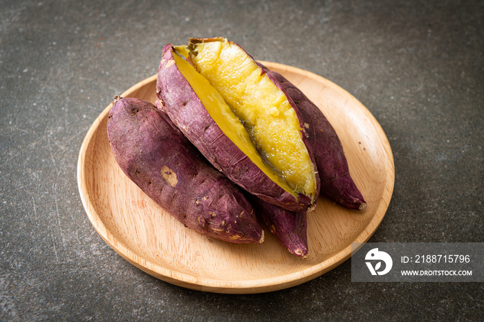 Grilled or baked Japanese sweet potatoes on wood plate