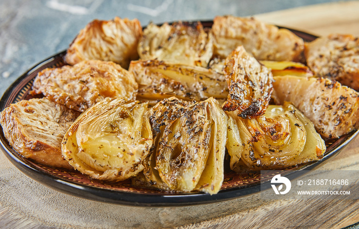 Celery and fennel baked in the oven. French gourmet cuisine