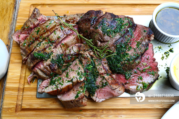 Portion of grilled beef chateaubriand with herbs