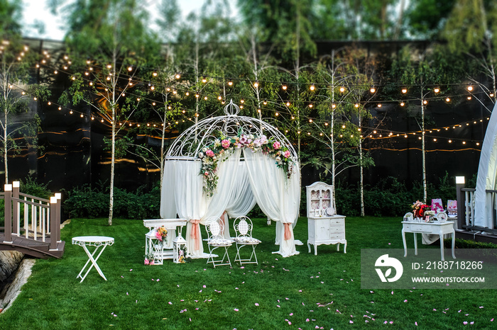 White arch for the wedding ceremony