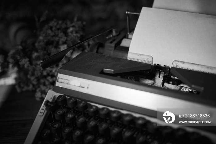 Old vintage typewriter on a desk, cinematic noir scene