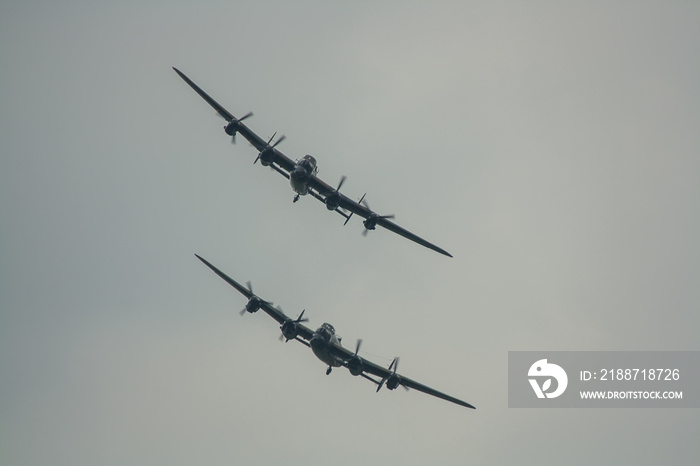 The last two remaining airworthy Avro Lancasters heavy bombers performing a duet in the skies