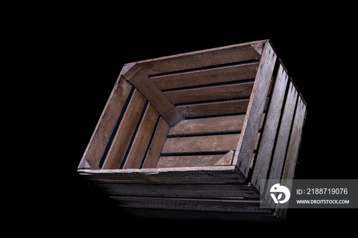 Raw wooden crate for storing vegetables and fruits. Container used on a farm.