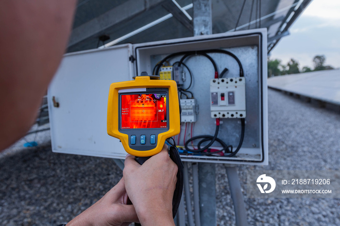 Thermoscan(thermal image camera), Industrial equipment used for checking the internal temperature of the machine for preventive maintenance, This is checking therminal DC fuse of solar panel