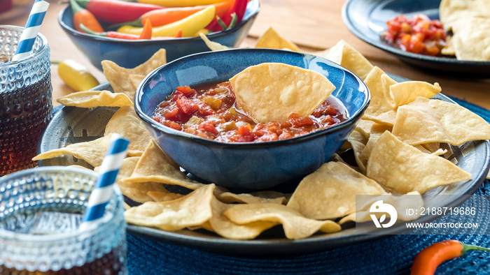 Authentic tortilla chips with a bowl of fresh gourmet salsa for dipping.