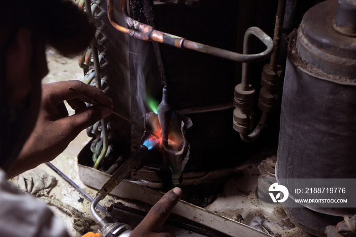 Service technician repairing Air conditioner