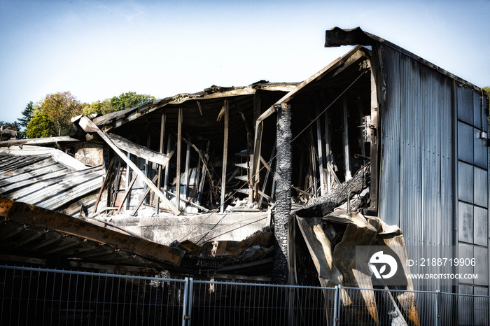 Burned damaged ruins of destroyed industry arson investigation insurance