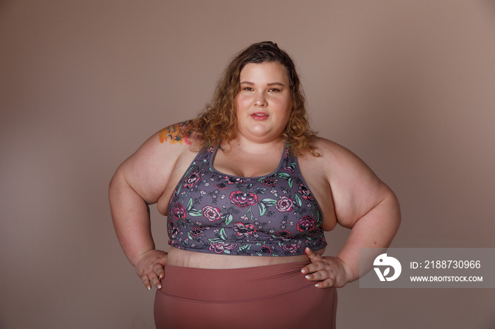 portrait of a plus size woman looking strong