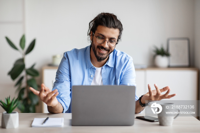 Video Conference. Friendly man office employee in headset having call on laptop