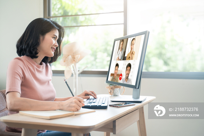 Asian business woman talking to colleague team about plan in video conference. Group of multiethnic business people using computer for online meeting in video call conference. Smart working from home.