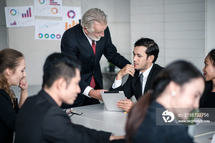 Mature Businessman Discussion with Business People Teamwork in Conference Room - Corporate Concept