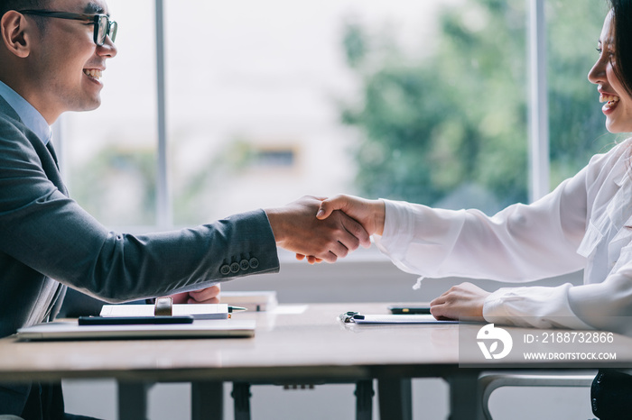 Asian male director is interviewing to recruit new employees