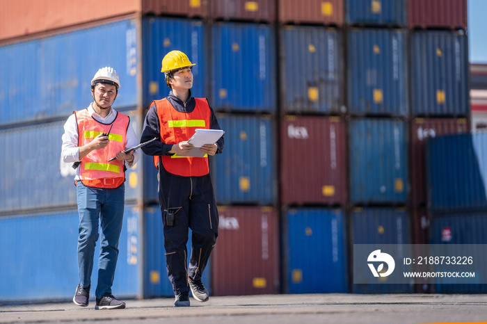 Logistics engineer control at the port, loading containers for trucks  export and importing logistic concept