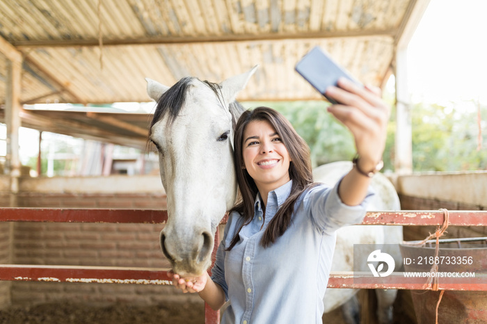 Rancher Capturing Memories While Feeding Horse