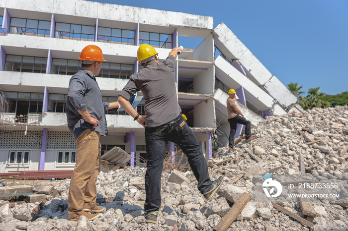 Engineer team and worker checking blueprint for emolition construction plan and inspect at the site.