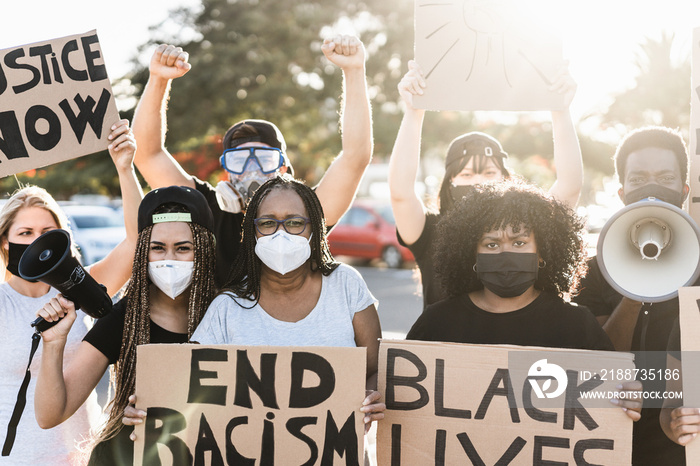 People from different ages and races protest on the street for equal rights - Demonstrators wearing protective masks during black lives matter no racism campaign - Focus on mature woman face