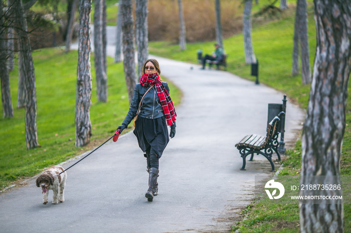 woman taking her dog for a walk