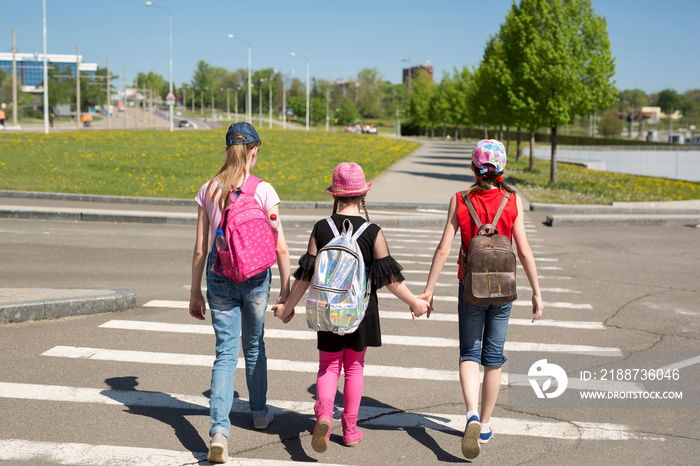 Schoolchildren crossing the road on their way to school