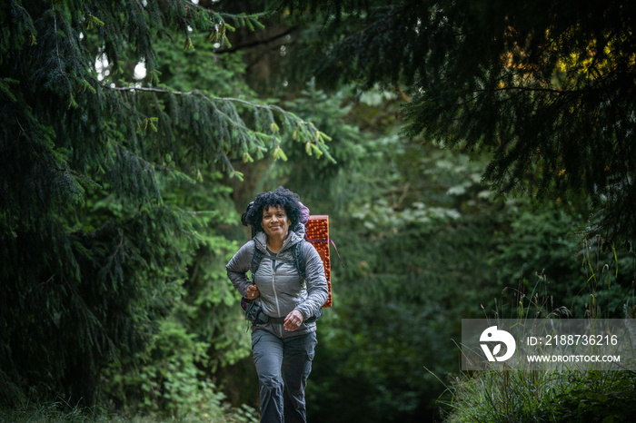 U.S. Army female soldier putting in the miles with an early morning hike in the NorthWest.