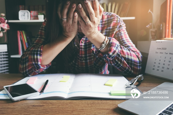 Stressed businesswoman Frustrated and upset in business pressure and overworked at office. Adult woman working on laptop, feeling tire and headache. Stressed and Frustrated concept