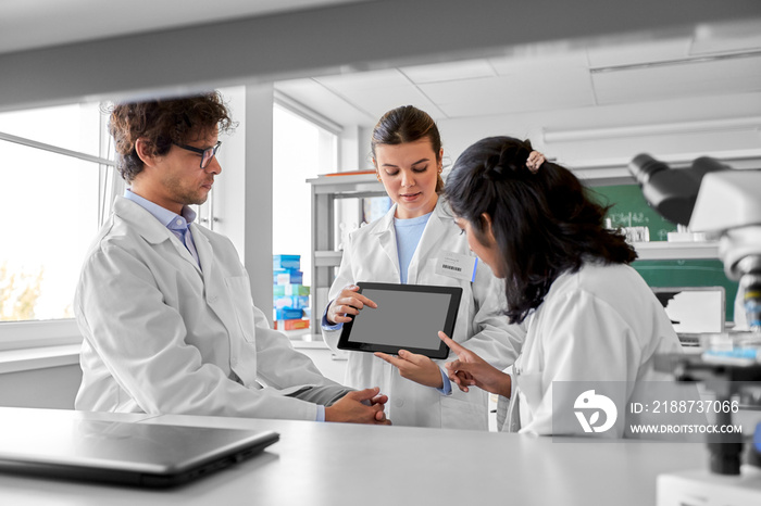 science research, work and people concept - international group of scientists with tablet pc computer working in laboratory