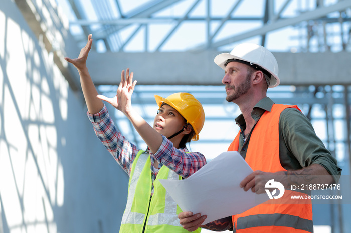 Young men and women inspecting new buildings.