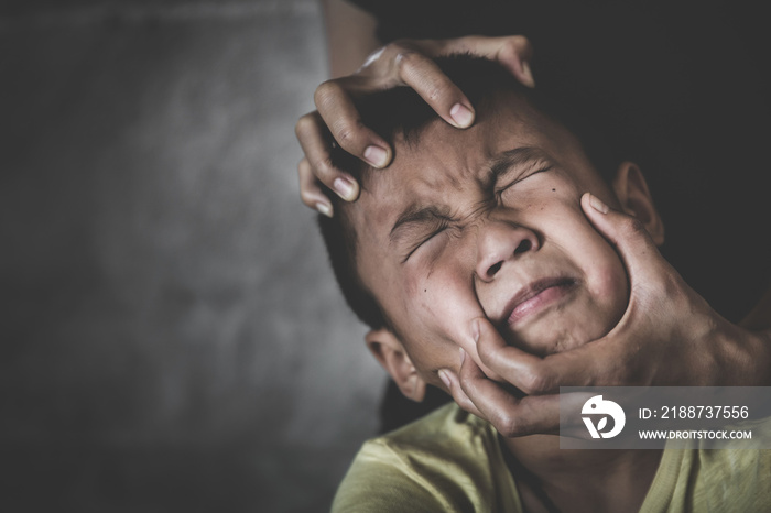 Scared  child with an adult man’s hand covering her face. stop abusing violence,  human trafficking, stop violence against child, Stop child abuse, Child labor, Human rights violations.