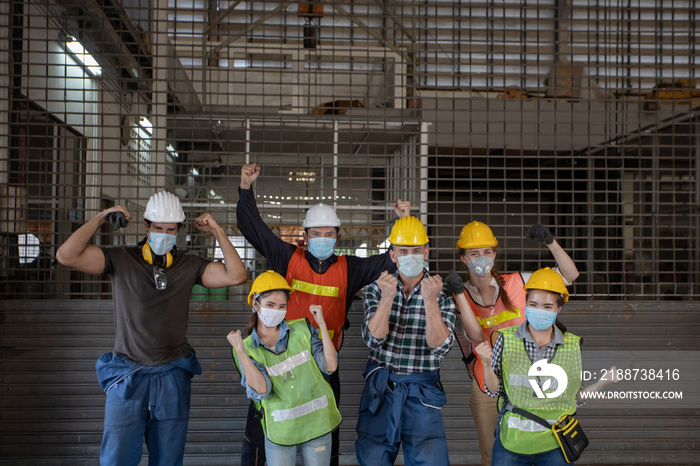 group happy worker team making high hands over head in factory for business success and teamwork concept in company