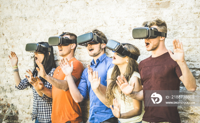 Friends group playing on vr glasses outdoors - Virtual reality and wearable tech concept with young people having fun together with headset goggles - Digital generation trends - Retro contrast filter