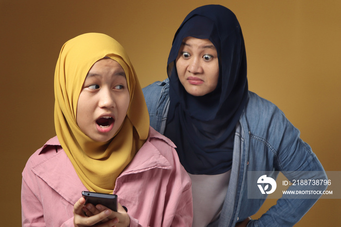 Asian muslim mother shocked and worried to see her daughters phone, bad content for kid