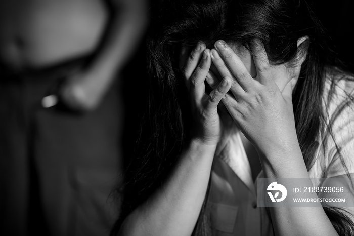 Aggression in the family, man beating up his wife. Domestic violence concept.